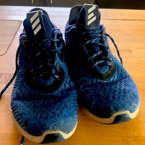 Blue alpha bounce adidas shoes.